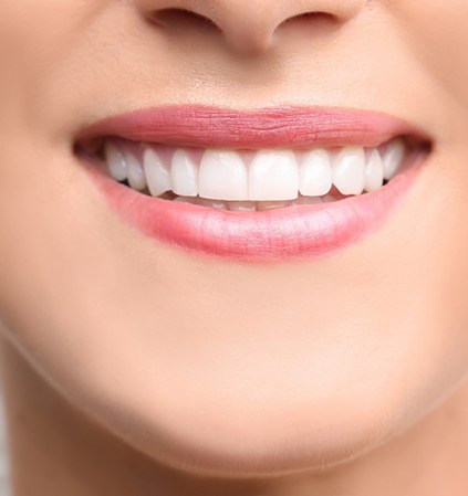 Closeup of woman's healthy, white, beautiful smile