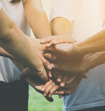 Group of people holding hands