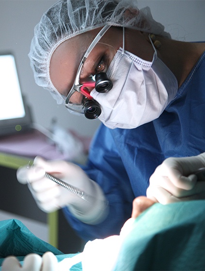 Dentist practicing on patient during dental school