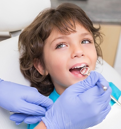 Child receiving dental checkup