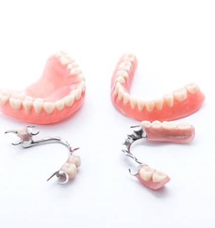 two full dentures and two partials