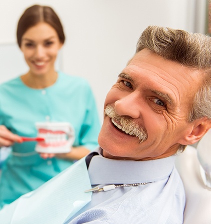 A senior man getting dentures