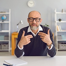 A mature man speaking