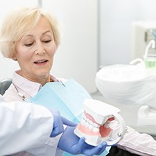 An elderly woman getting dentures in Richmond
