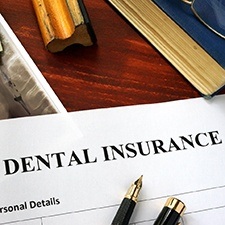 Dental insurance paperwork on desk