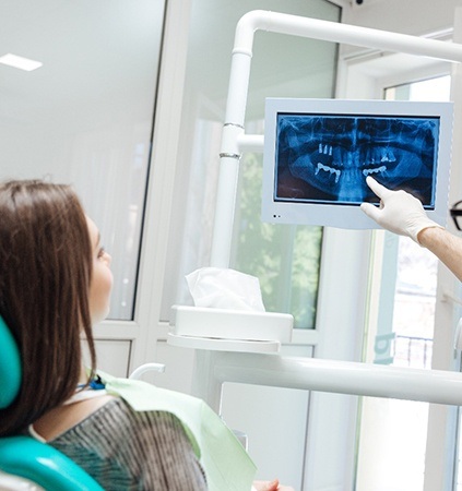 dentist showing a patient their dental X-rays