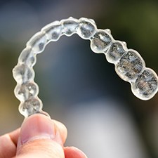 Closeup of Invisalign in Richmond on colorful background