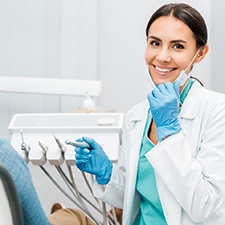 Dentist smiling at patient's dental exam