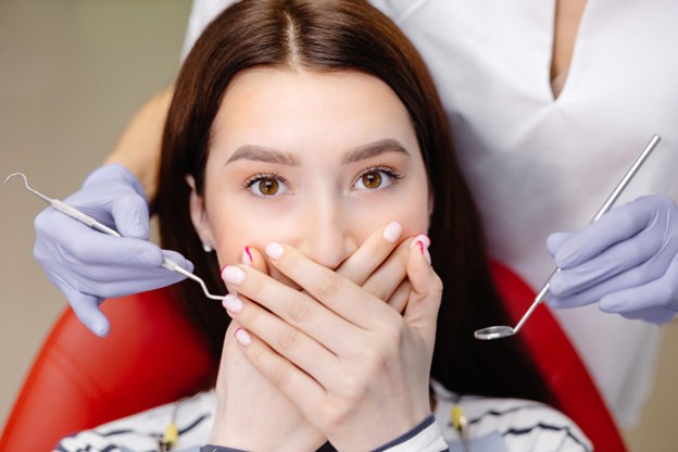 Patient in Tuckahoe covering their mouth in surprise