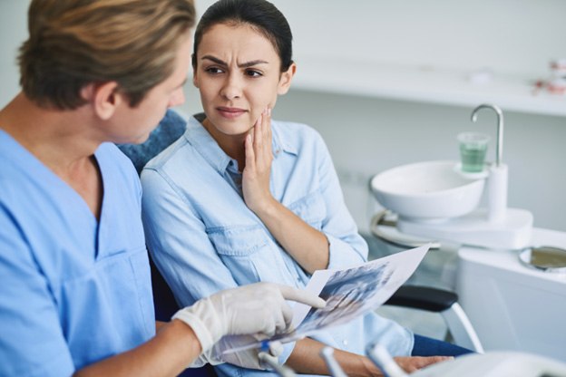Patient in Tuckahoe holding their cheek