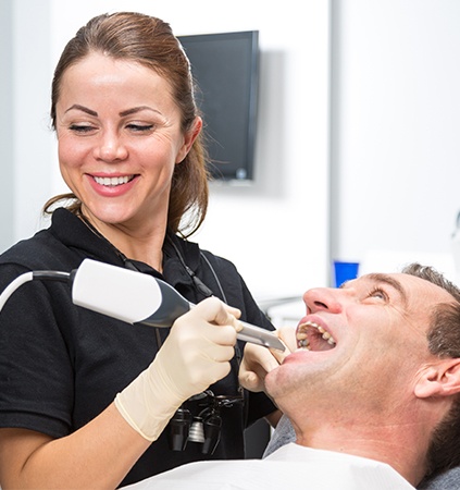 Dental team members capturing images of patient's smile