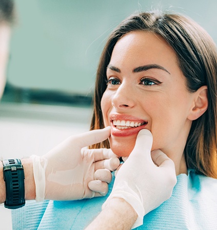 dentist looking at patient’s smile