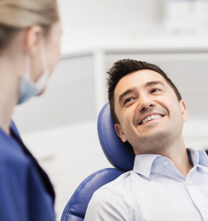 Man smiling after receiving teeth whitening in Patterson 