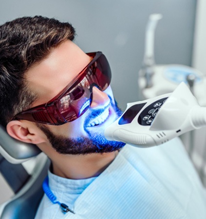 Woman smiling after teeth whitening in Patterson