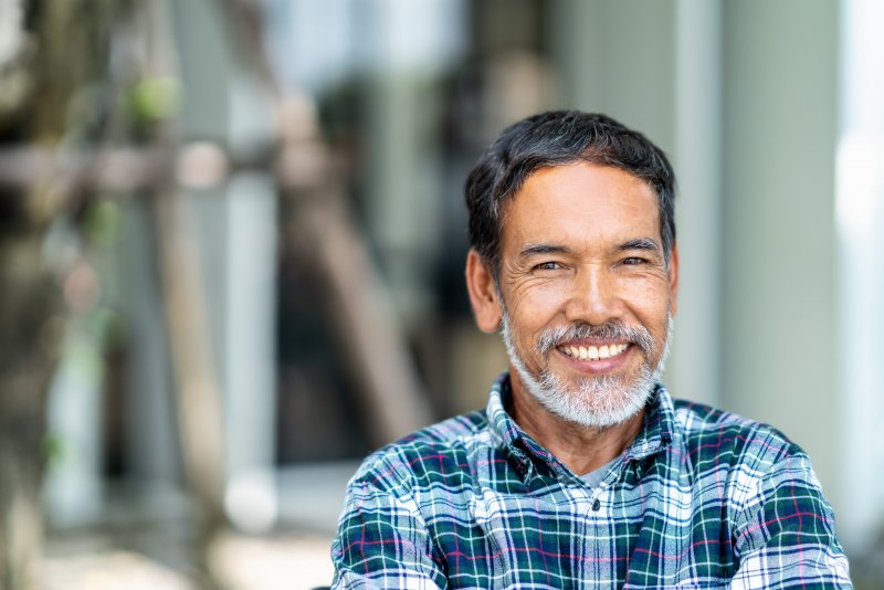 Man smiling with dental crown