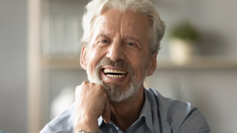 man smiling with dentures